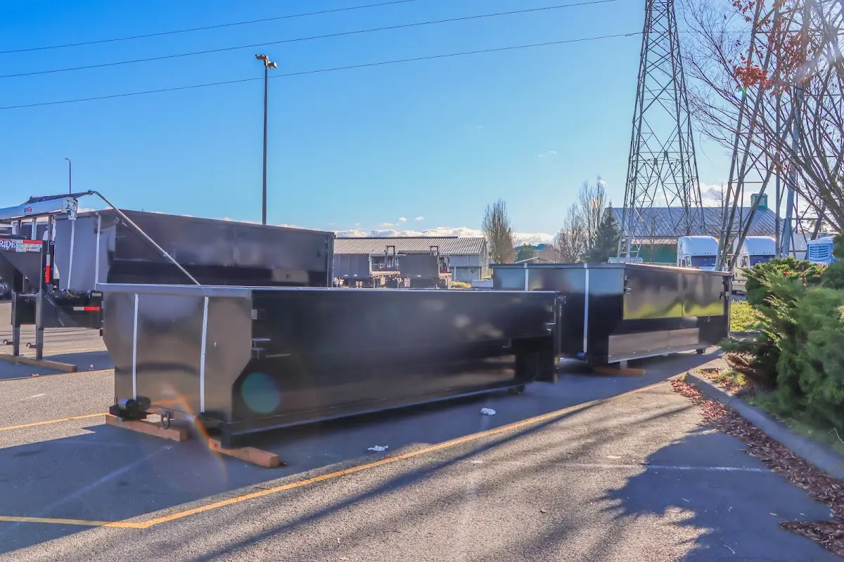 Roll-off dumpster ready for waste disposal at job site for 3 Yard Dumpster Rental in Cranston